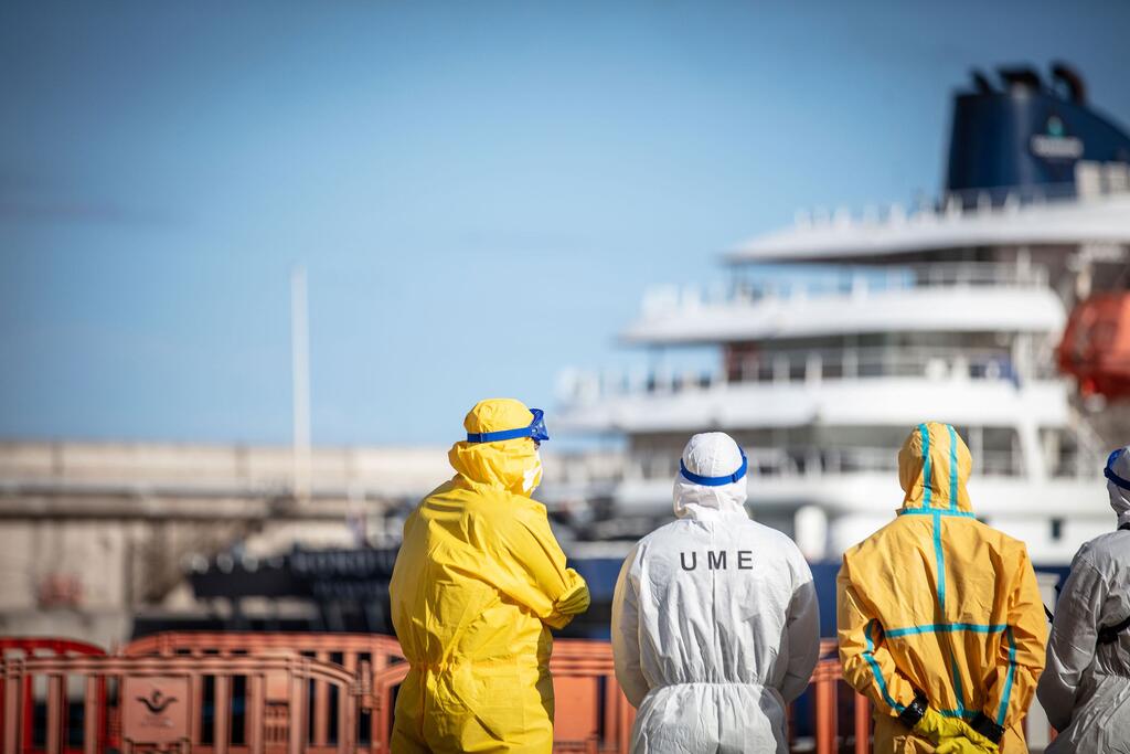 Health officials in PPE oversee the response to the hantavirus outbreak onboard the cruise ship MV Hondius moored off Tenerife in the Canary Islands.
